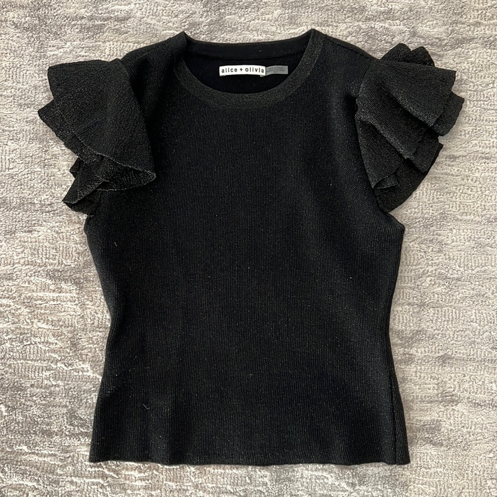 Alice and Olivia blk knit top. Ruffle sleeve